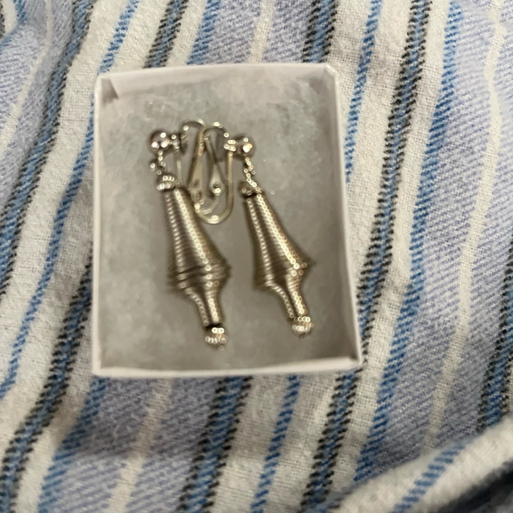 Clip style silver colored earrings